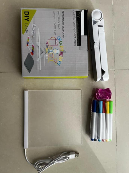 3D LED writing pad with colorful markers, USB cable, and adjustable lamp for creative drawing