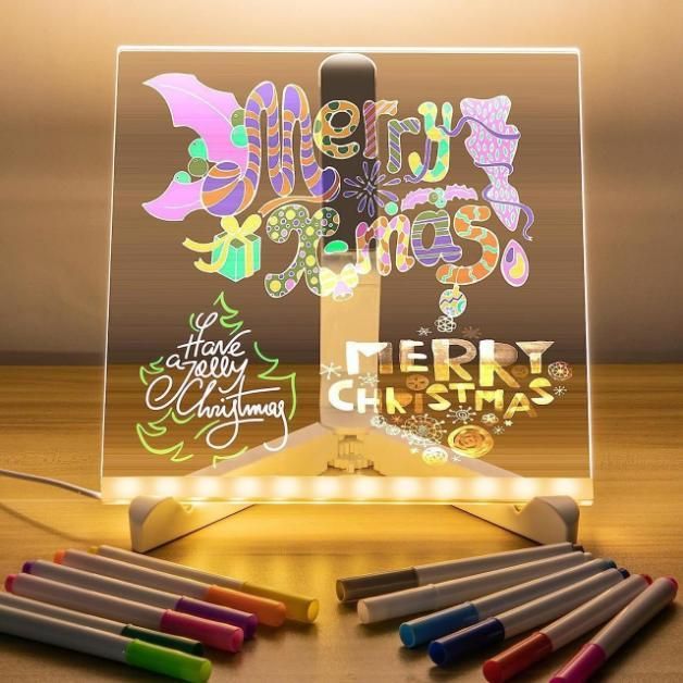 Colorful 3D LED writing pad displaying festive holiday messages with vibrant art supplies