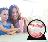 3D sand art picture featuring flowing sands in a decorative display with a woman and child enjoying a drink