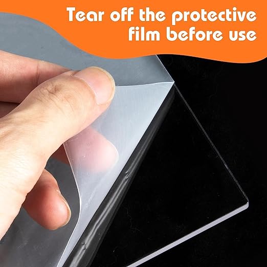 Person removing protective film from an Acrylic LED writing board for better visibility and usage