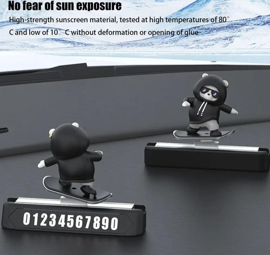 Cute panda figurine car dashboard decoration on a sleek dashboard with snow-capped mountains in the background