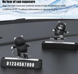 Cute panda figurine car dashboard decoration on a sleek dashboard with snow-capped mountains in the background