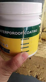 Container of waterproof glue for bathrooms held in hand against a brick wall background