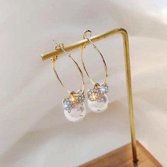 Meher Collection elegant bow knot earrings with sparkling crystals and pearl accents