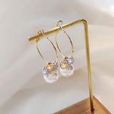 Meher Collection elegant bow knot earrings with sparkling crystals and pearl accents