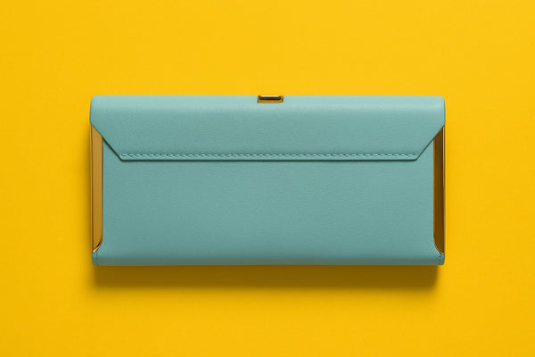 Elegant pink studded clutch featuring a sleek design perfect for evening outings