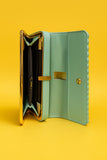 Elegant pink studded clutch with a sleek design and spacious interior for essentials