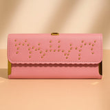 Elegant pink studded clutch with gold accents and stylish design for evening outings