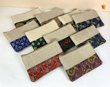 Variety of ethnic cotton canvas clutch bags in different colors and patterns, perfect for stylish accessories