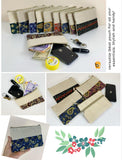Ethnic cotton canvas clutch bags in various colors and patterns, perfect for organizing essentials