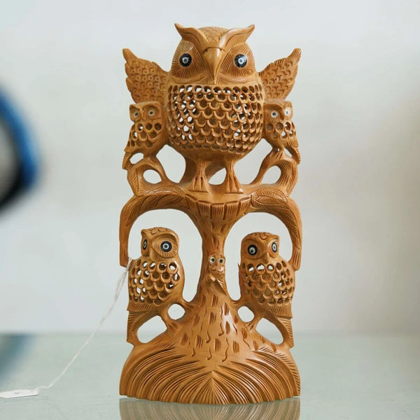 Handcrafted wooden owl decor featuring a detailed design with multiple owls on a tree
