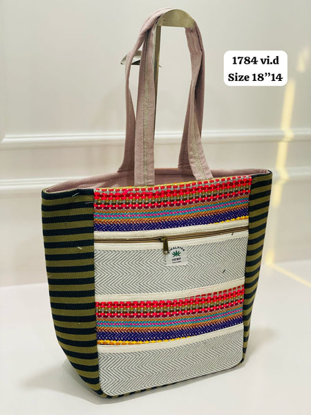 Himalayan hemp tote bag with colorful woven design and two exterior zip pockets