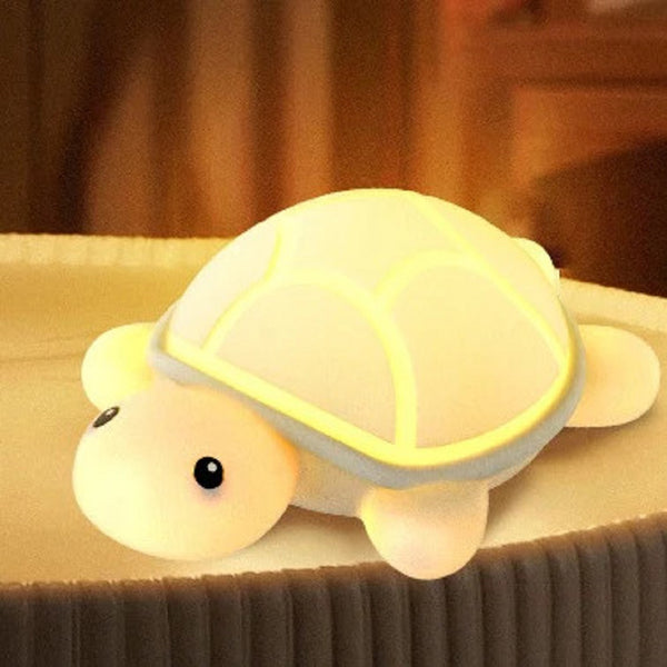 Cute LED turtle night light in soft yellow hue, perfect for children's bedrooms and nurseries