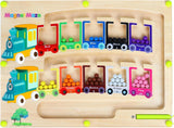 Colorful Montessori puzzle game board with a train and magnetic balls for educational play