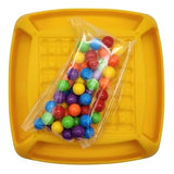 Colorful rainbow board game for kids with a bag of vibrant game pieces on a yellow game board