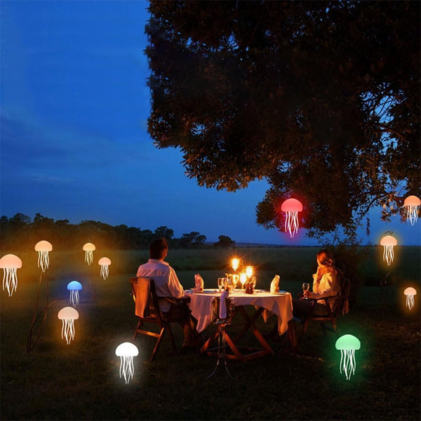 RGB jellyfish lamp creates a colorful ambient glow for outdoor dining and relaxation