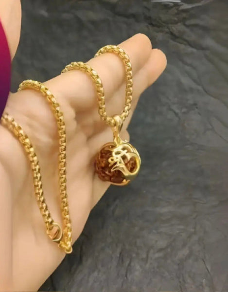 Elegant Rudraksha pendant with chain displayed on a hand, perfect for Valentine's Week gifting