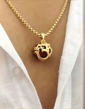 Elegant Rudraksha pendant with chain showcased on a stylish outfit, perfect for Valentine's Week