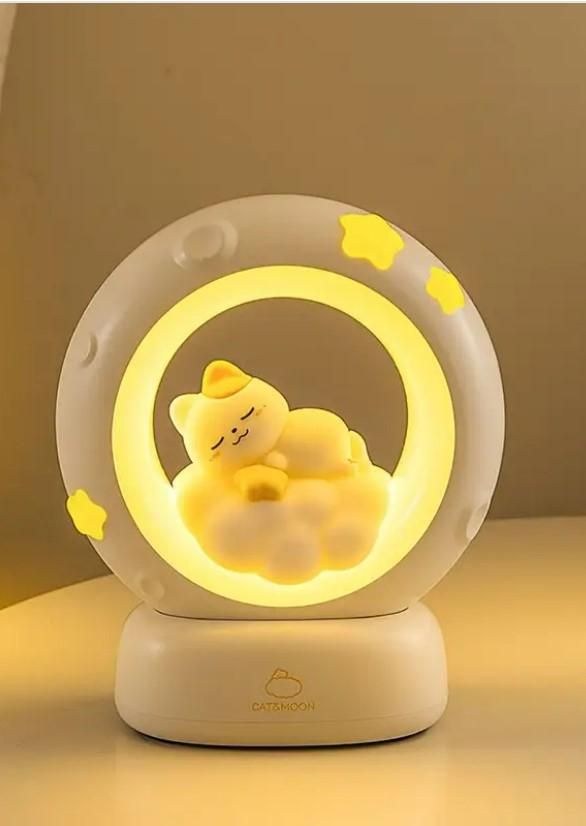 Sleeping Cat LED Night Light in a circular design with soft yellow glow for a cozy bedroom ambiance