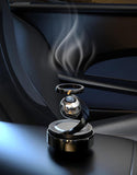 Dropdash solar levitating car air freshener with a sleek design and aromatic vapor for a refreshing drive
