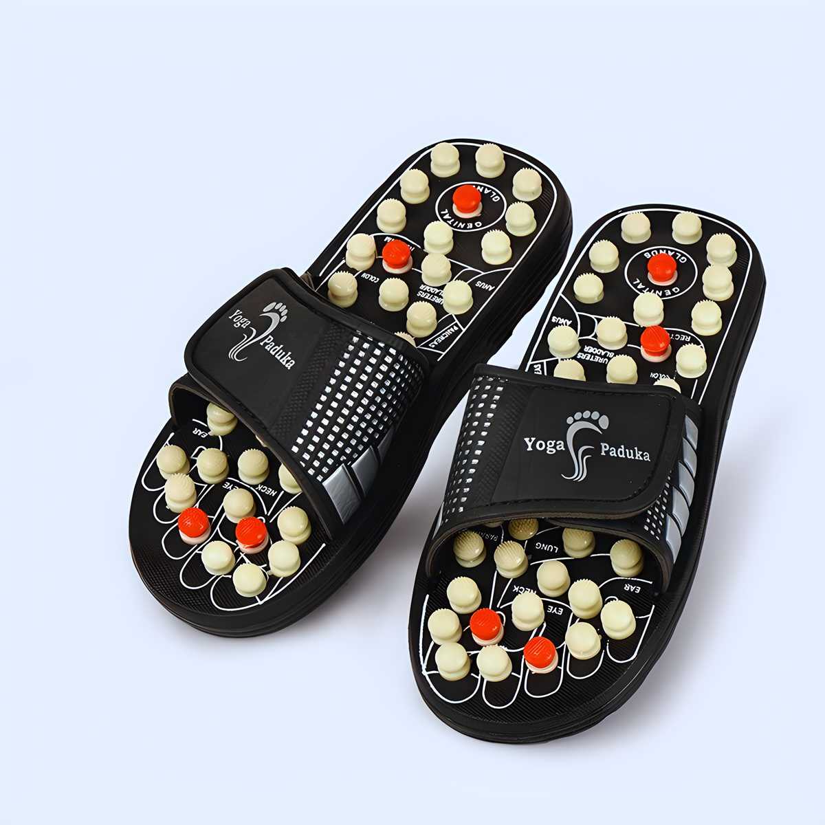Black acupressure therapy slippers with adjustable straps and raised acupressure nodes for foot pain relief